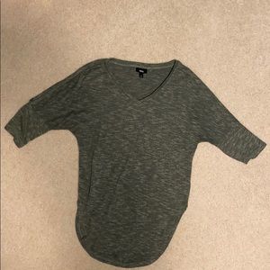 V-neck green shirt.